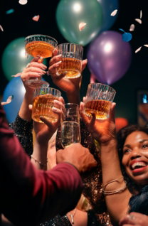 a group of people holding up glasses of wine